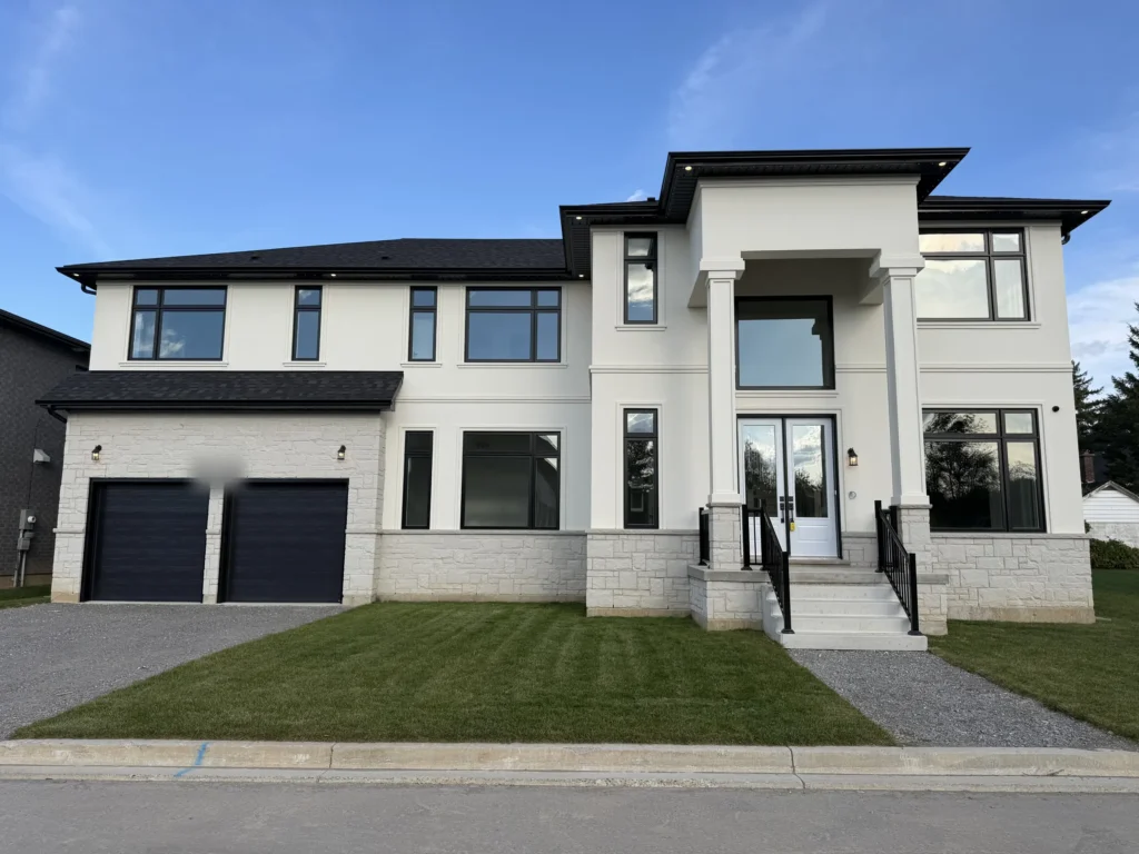 Modern two-storey Scarlett Homes exterior with stucco, stone and a double garage