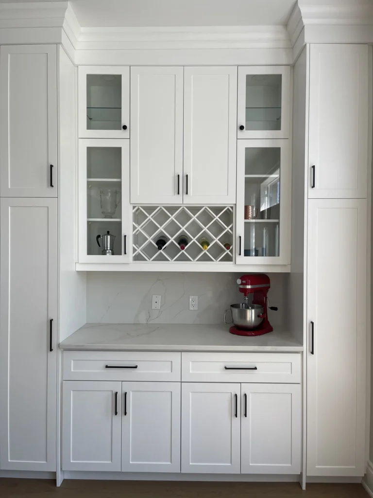 Built-in kitchen hutch with a wine rack and glass-front cabinets