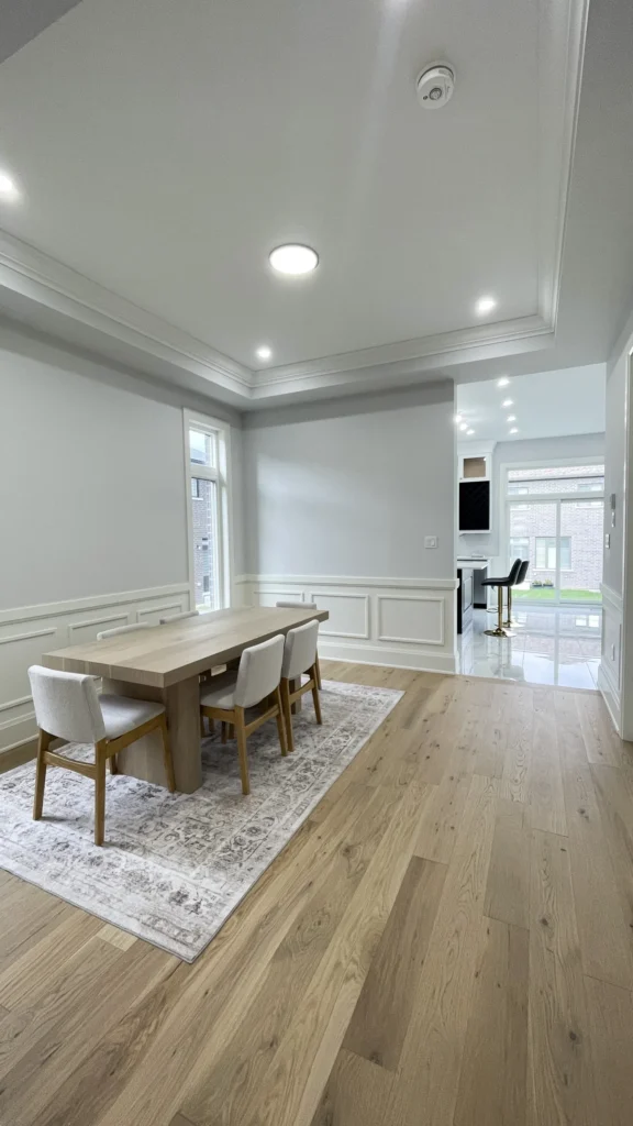 Dining room with engineered hardwood floor and tray ceiling